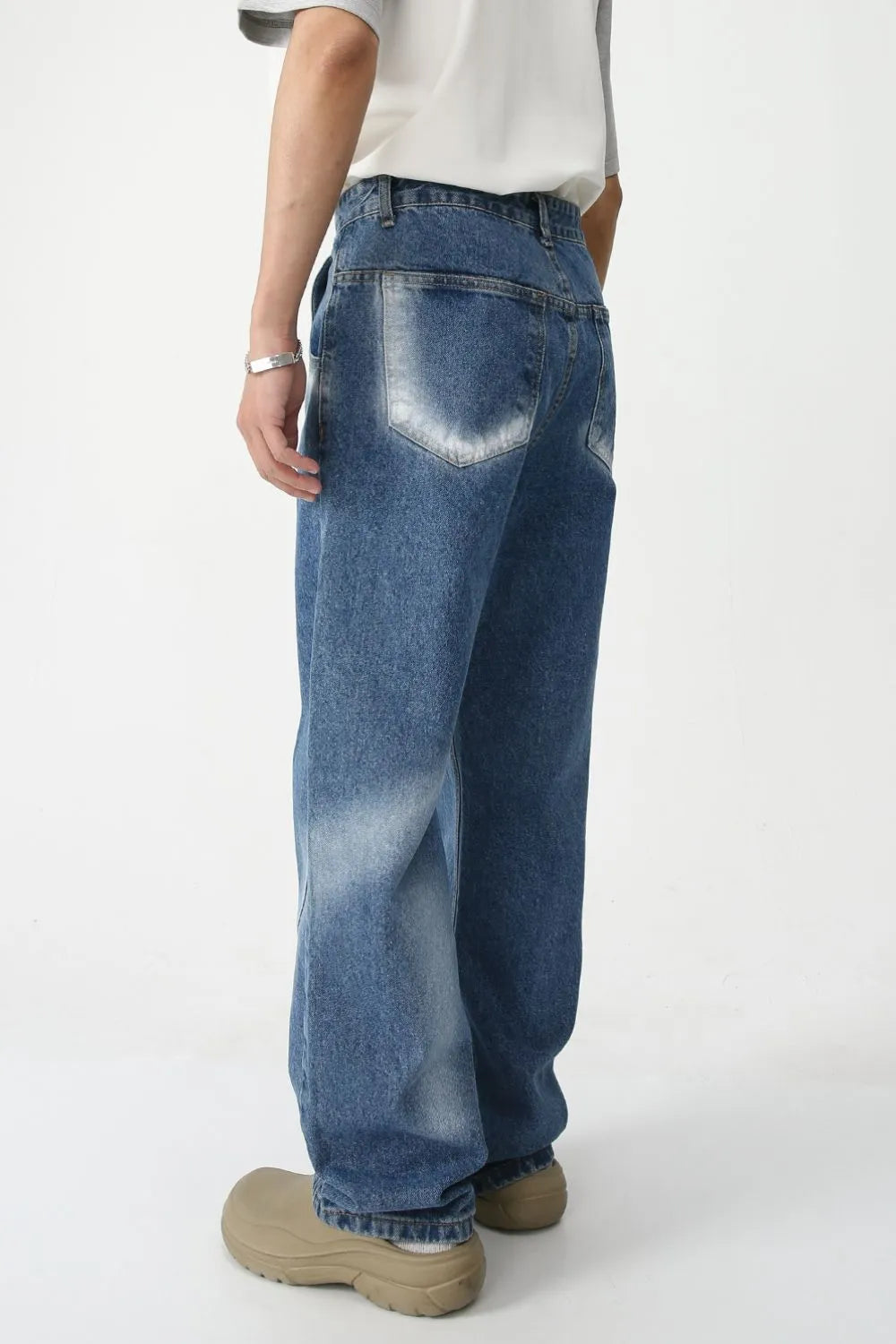 Faded Panel Wide-Leg Jeans in medium wash denim with a relaxed fit.