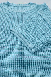 Relaxed blue ribbed knit sweater top with crew neck and cuffed sleeves.