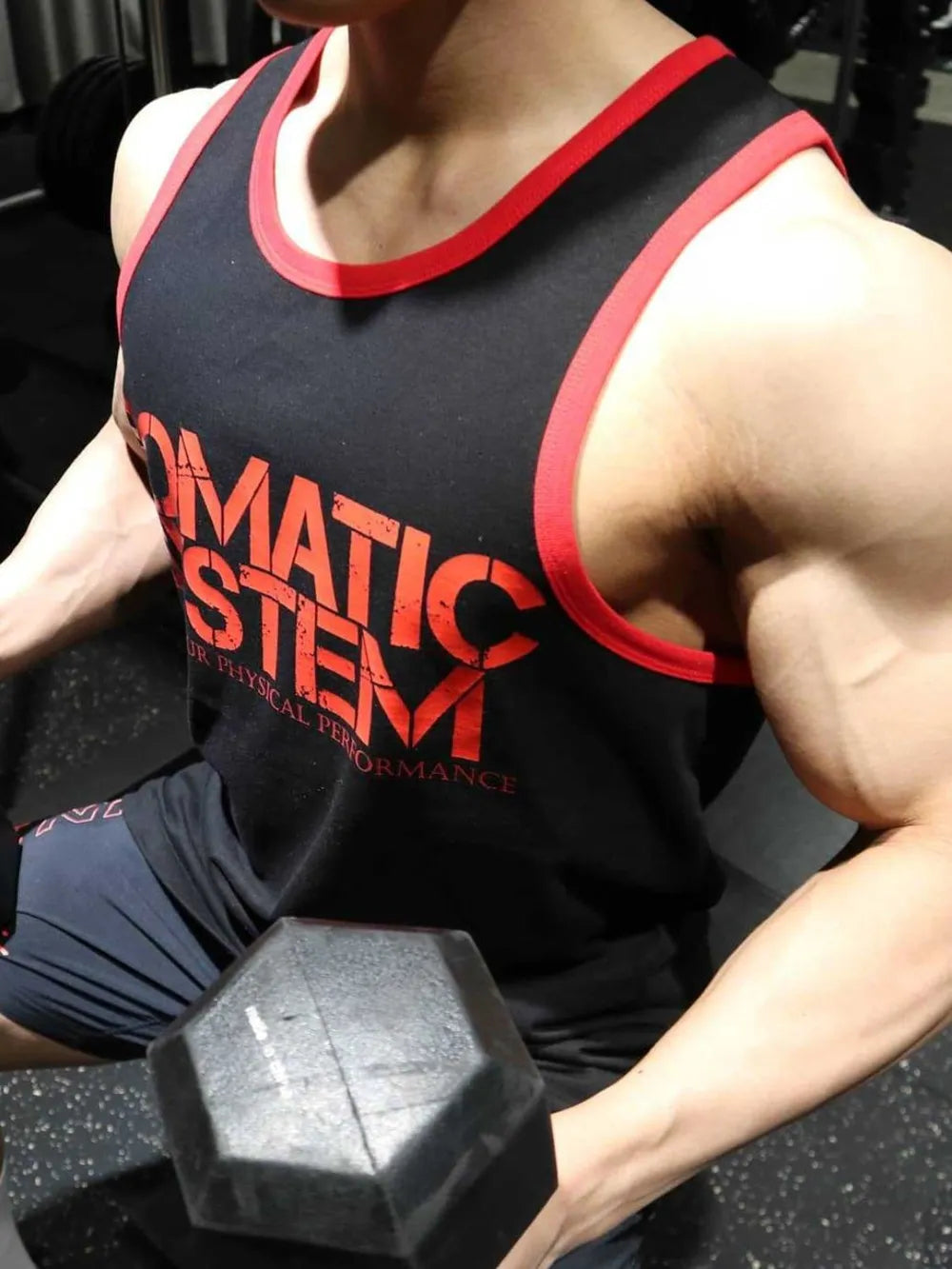 Black tank top with red trim and graphic print, activewear style