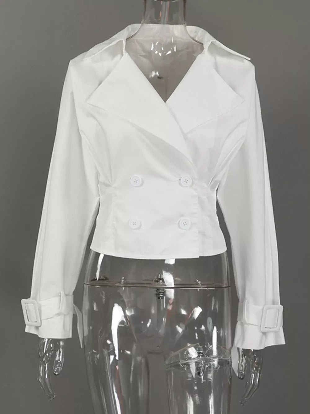 white blazer with buttoned cuffs and long sleeve
