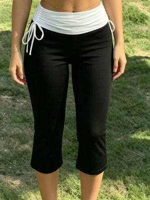 94% polyester, 6% elastane Care instructions: Machine wash cold capri pants in white with slim silhouette