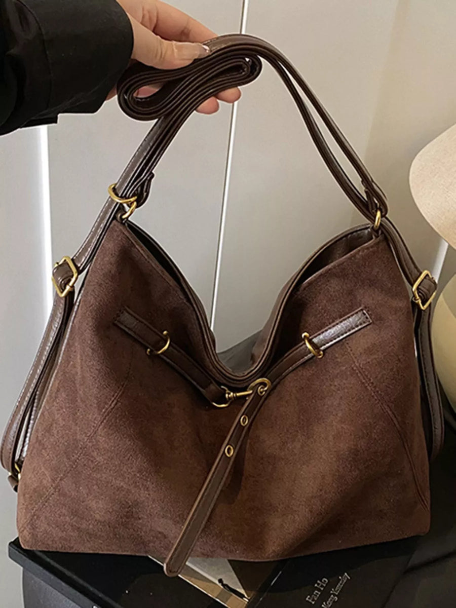 Chic suede large tote bag in brown with adjustable straps and gold hardware.