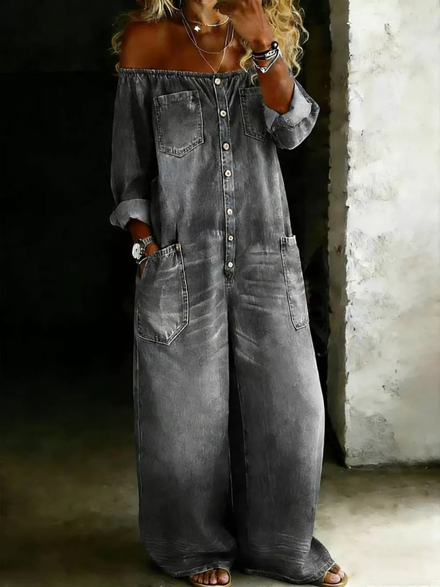 Gray off-shoulder denim jumpsuit with buttons and pockets.