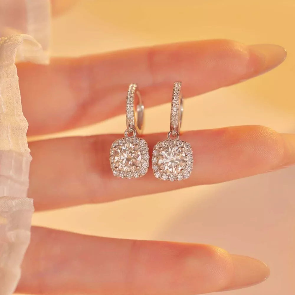 earrings in silver featuring halo setting and drop fit