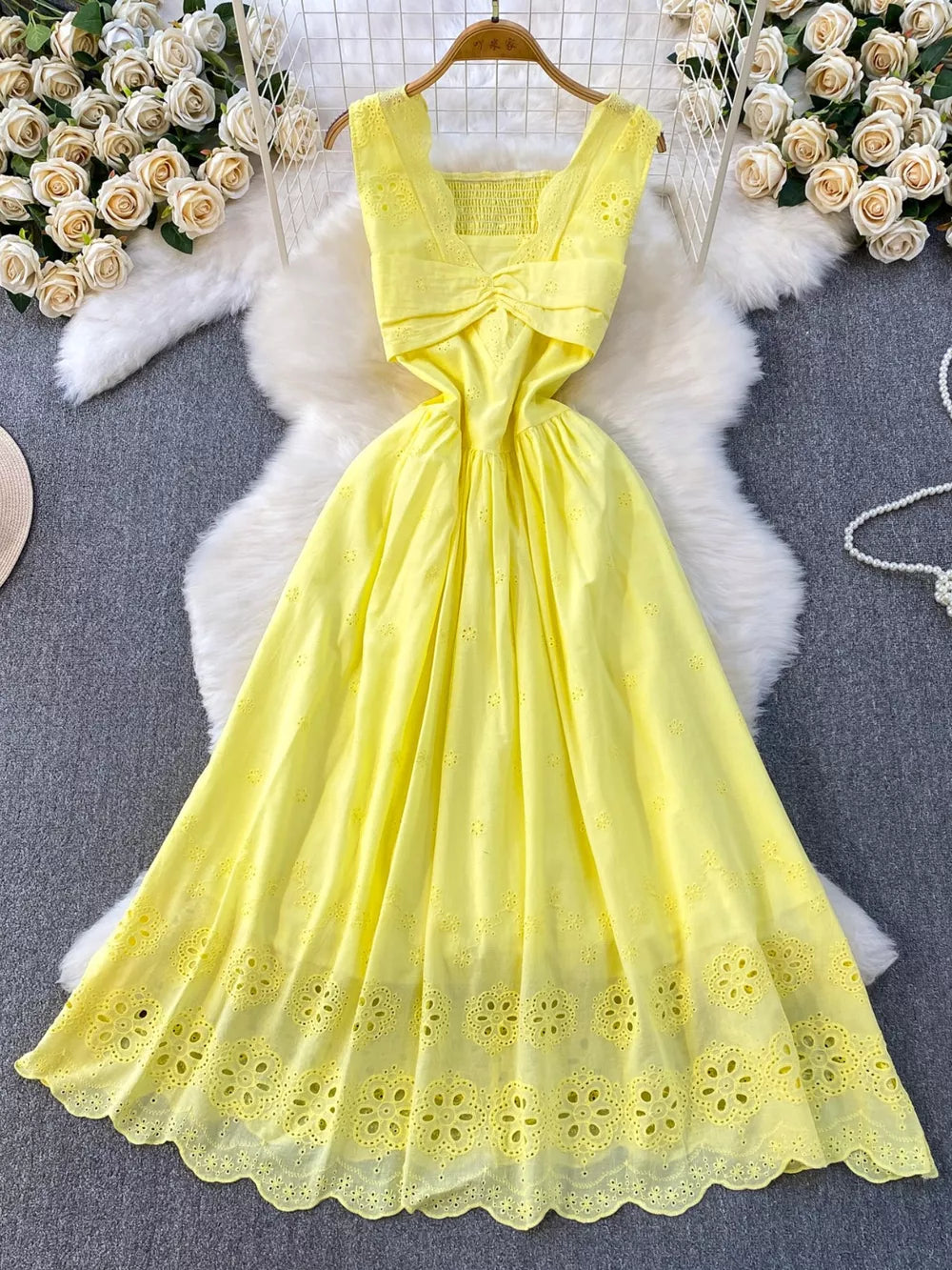 Yellow eyelet maxi dress with cutout detail and smocked bodice