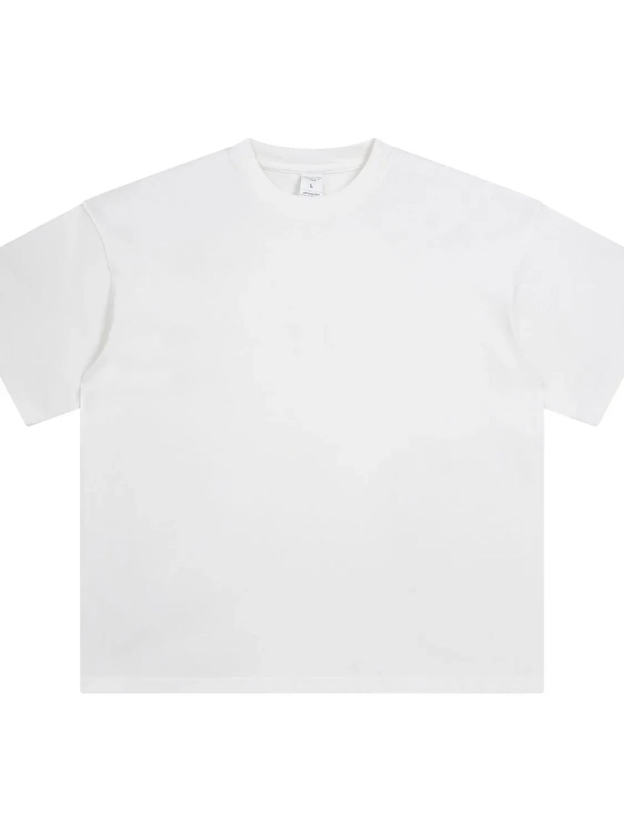 Oversized white washed cotton crewneck t-shirt with short sleeves.