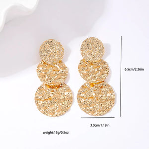 earrings in Golden with textured and layered
