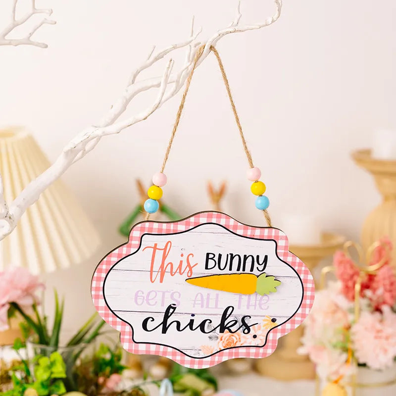 Easter signboard with beaded hanger and carrot graphic, reads This Bunny Gets All The Chicks.