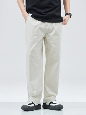Beige casual straight leg trousers with a loose fit, worn by a man.