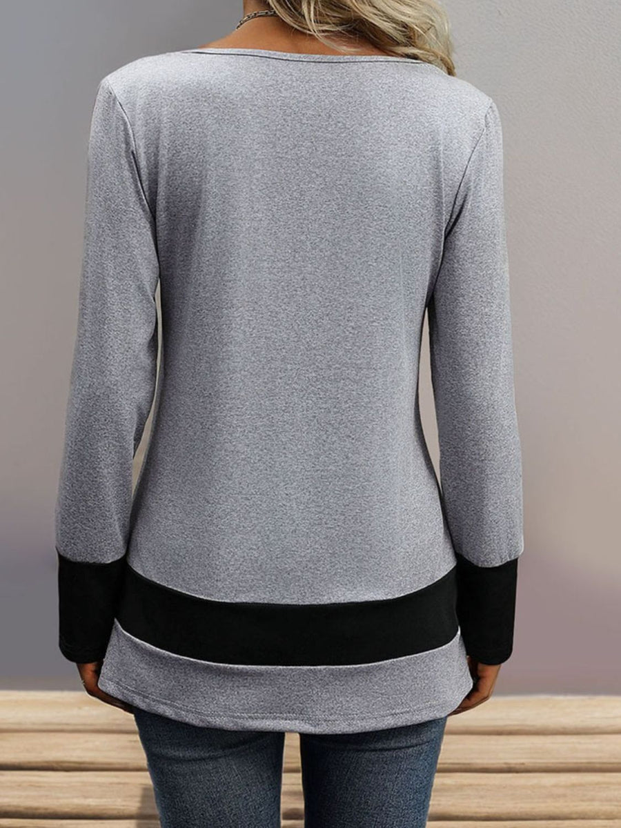 Gray long sleeve top with black contrast band detail at hem