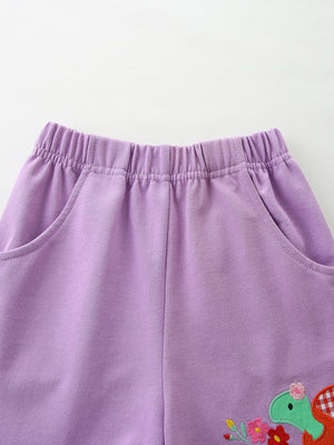 Purple cotton toddler shorts with elastic waist, pockets, and a sweet birdie graphic detail.