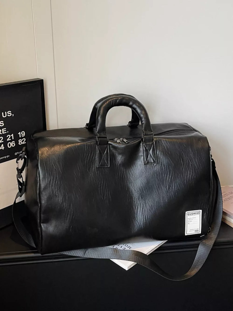 Black pu leather travel bag with top handles and adjustable shoulder strap