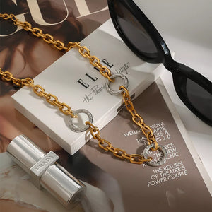 necklace in gold featuring chain link and straight fit