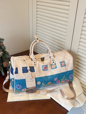 Flower Power duffel bag with blue floral and camper van print, beige with blue accents.