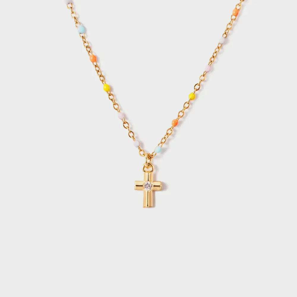 Gold necklace with rainbow beads and a diamond cross pendant