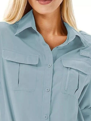 Sky blue button-up shirt with chest pockets and zippered pocket detail