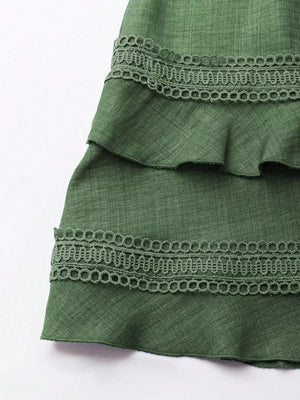 Green tiered mini dress with lace trim detail