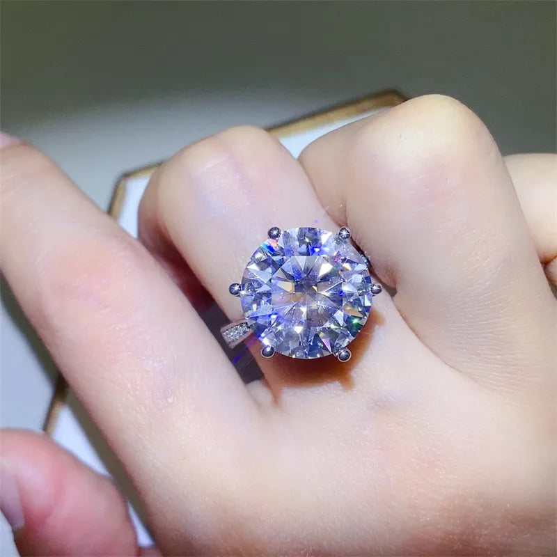Prismatic Halo Silver Engagement Ring with large round-cut diamond and small side stones.
