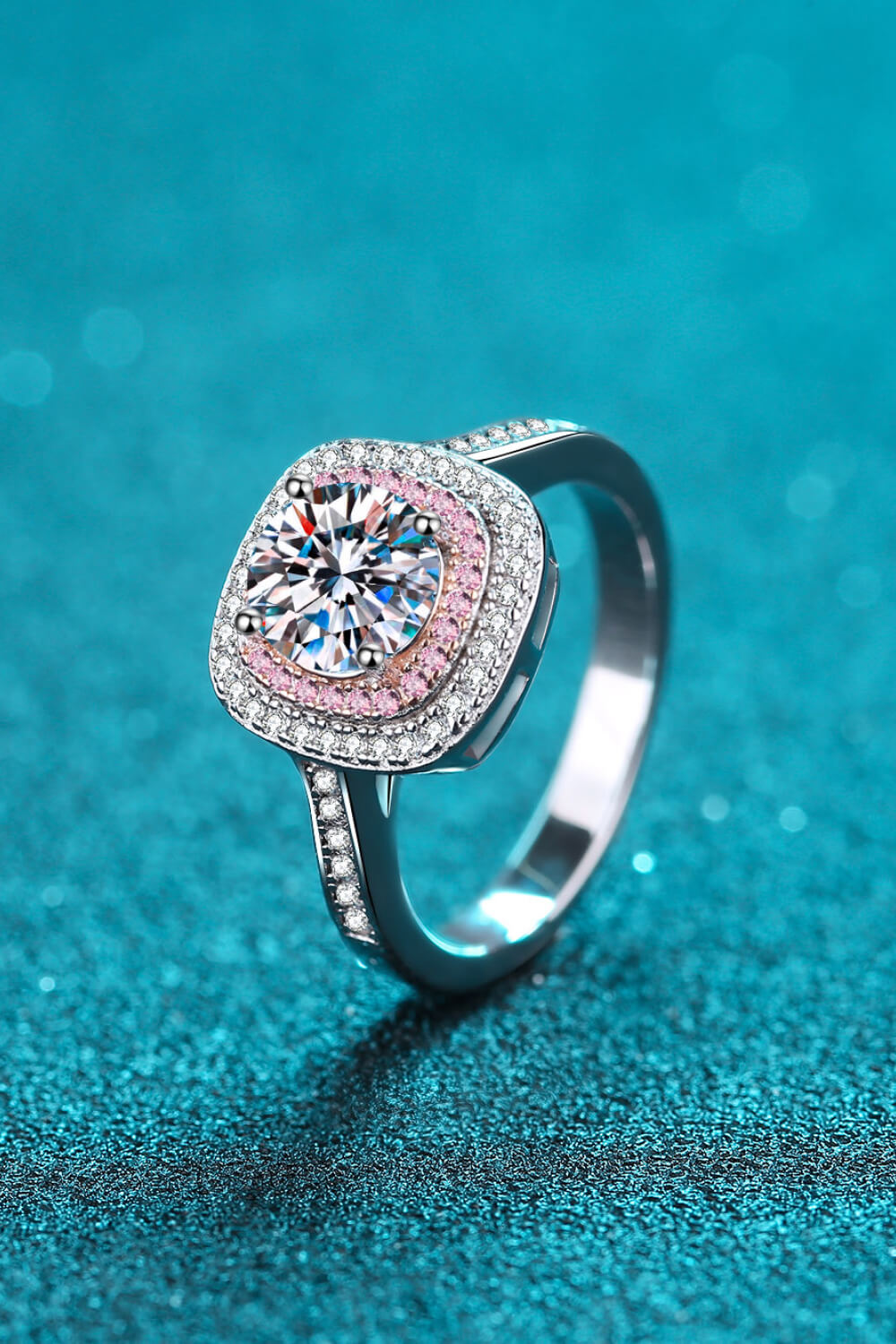 Silver ring with halo moissanite and pink diamond accents