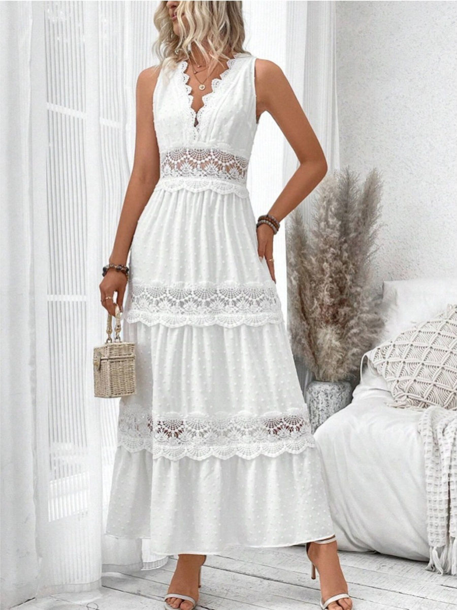 White lace trim Swiss dot maxi dress with tiered skirt and V-neckline.