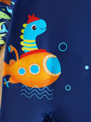 Baby swimwear with a blue dinosaur in a yellow submarine graphic on navy fabric.