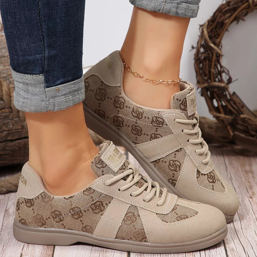 Chic lace-up monogram sneakers in beige with suede accents and a comfortable casual style.