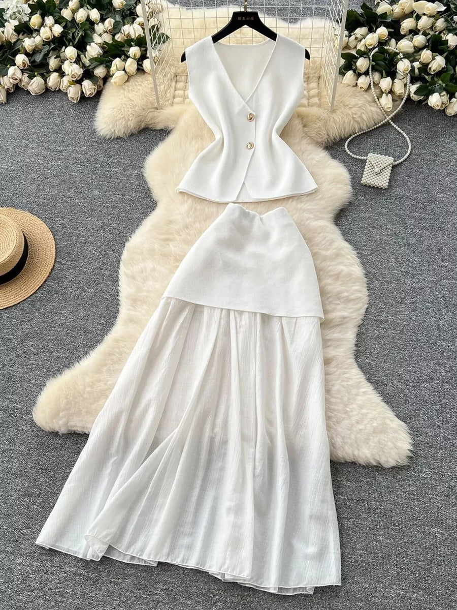 White sheer two-piece set with V-neck sleeveless top and flowing skirt, button details