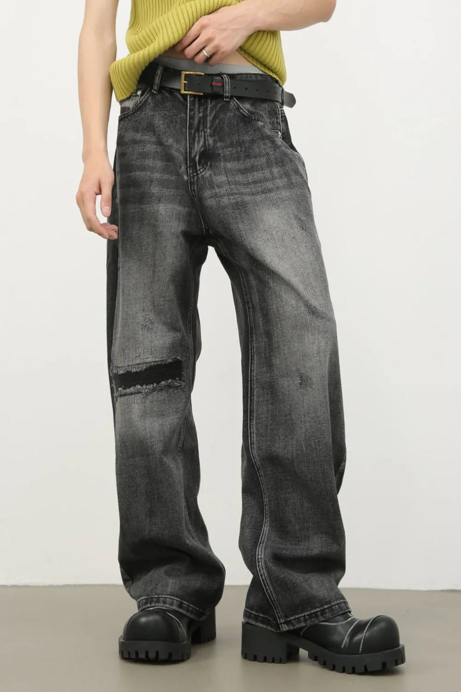 Baggy fit dark washed denim jeans with knee rips and a comfortable casual style.