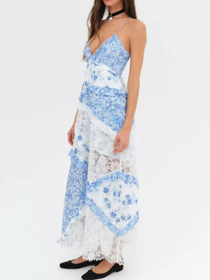 Light blue floral lace maxi dress with ruffles and a tiered skirt.