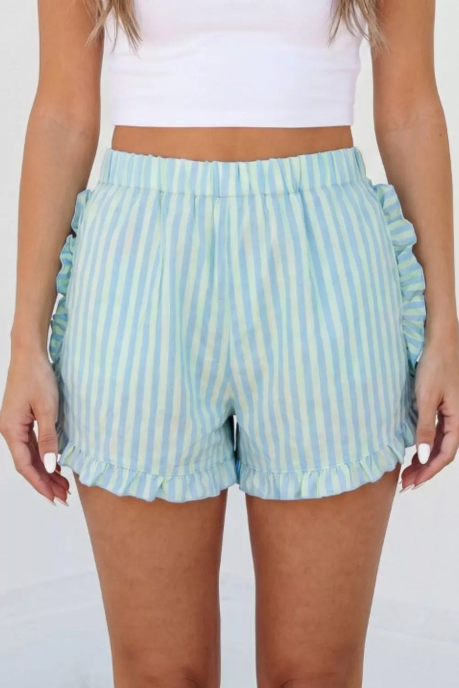 Ruffled striped cotton shorts in blue and green with elastic waist and hem.