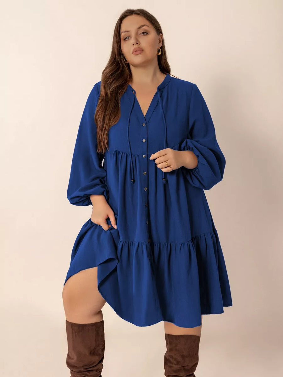 Plus-size dark blue a-line dress with tie-neck and button front