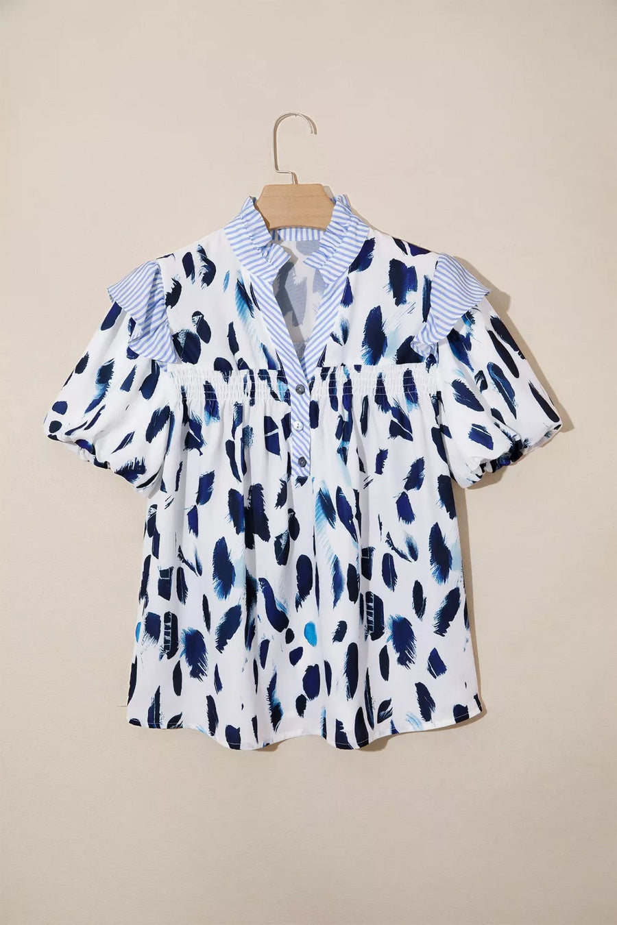 Vibrant abstract print polyester shirt with ruffled sleeves, V-neck and buttoned front.