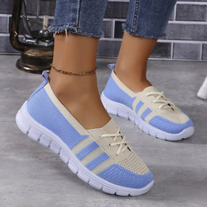 Breathable knit lace-up sneakers in blue and beige with striped accents.