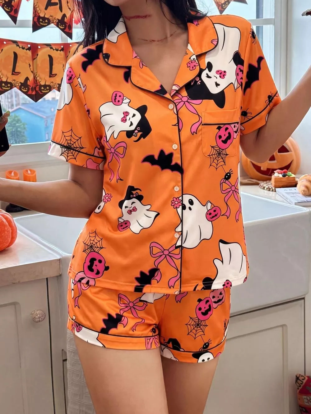 orange pajama set with Halloween print and collared