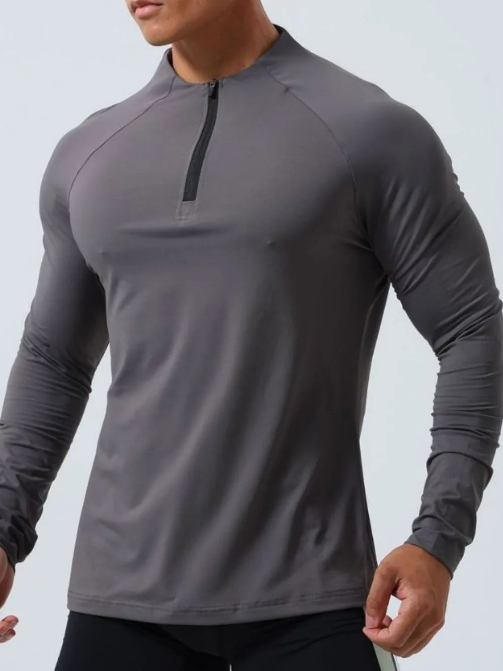 Dark Gray performance raglan zip-neck long sleeve active top with black zipper detail.