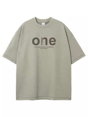 Sage oversized cotton t-shirt with "one" graphic and text detail