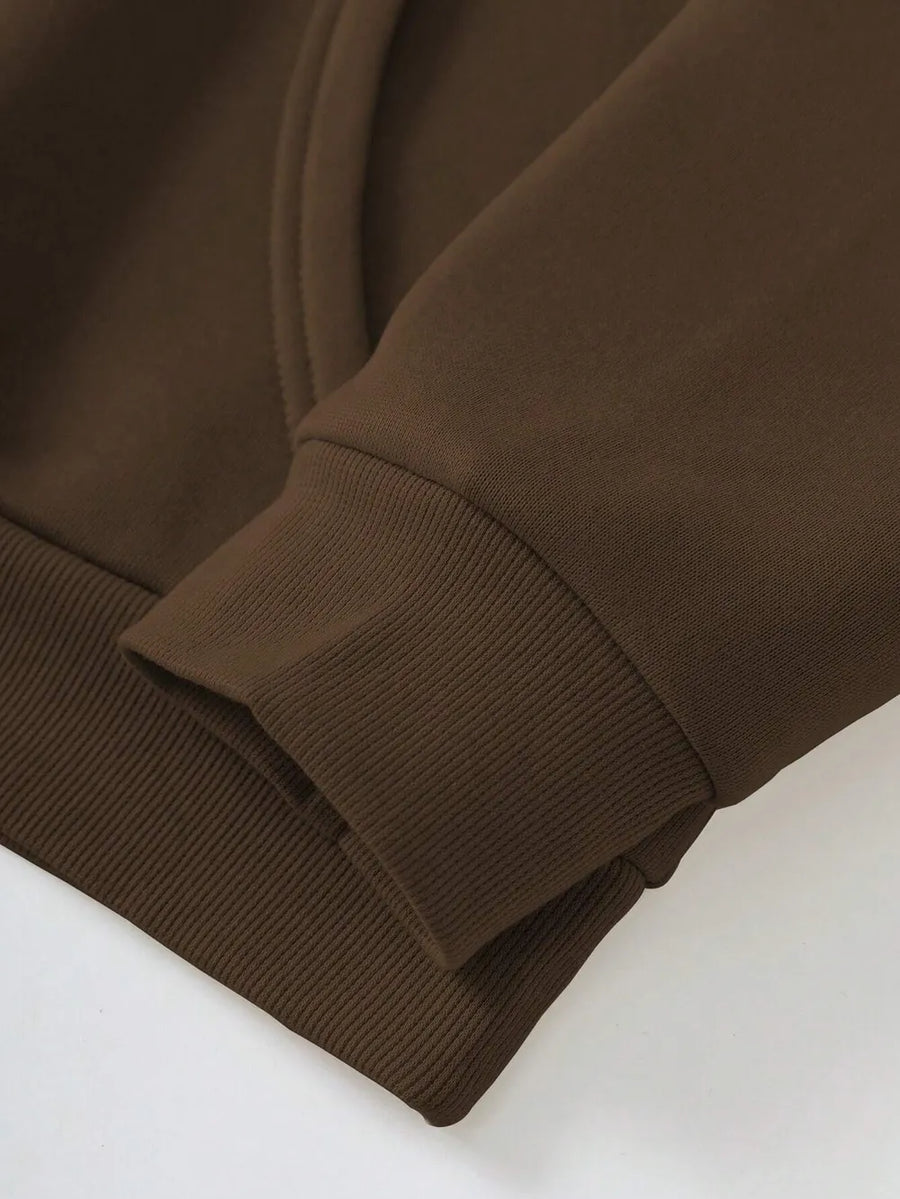 Dark brown hoodie with ribbed cuffs and hem detail.