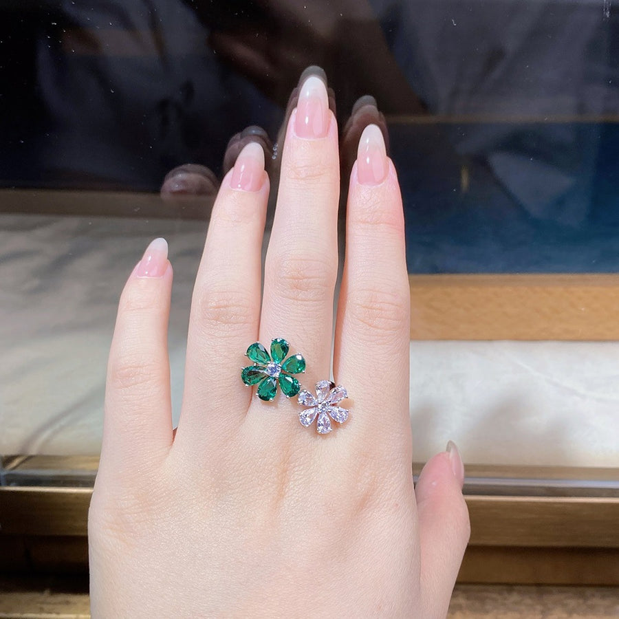 silver ring featuring adjustable and floral