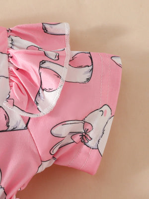 Pink baby dress with bunny print and ruffled sleeves.