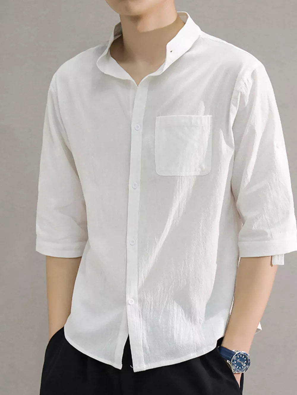White cotton button-down shirt with roll-up sleeves and chest pocket