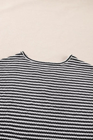Textured knit t-shirt with a notched neckline and black and white horizontal stripes.