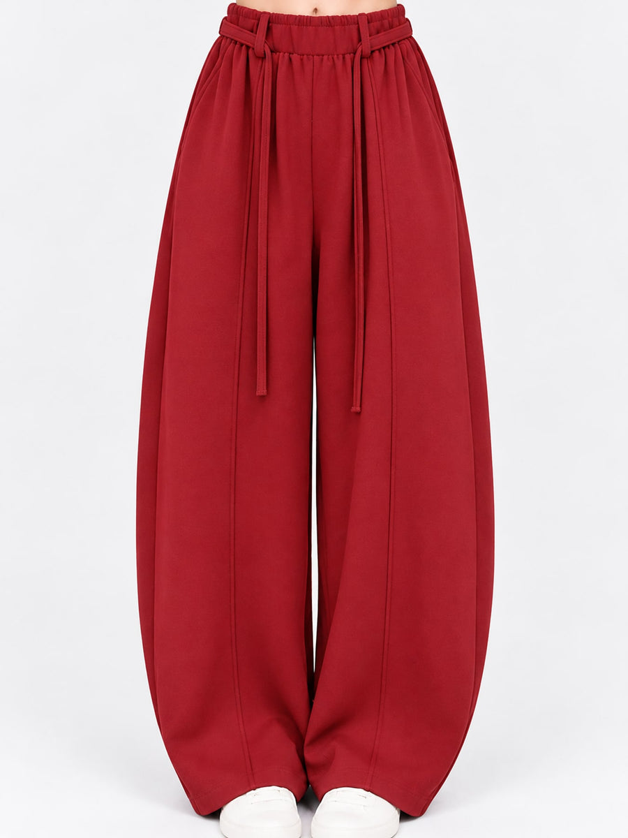 wide-leg pants in burgundy featuring adjustable and loose fit