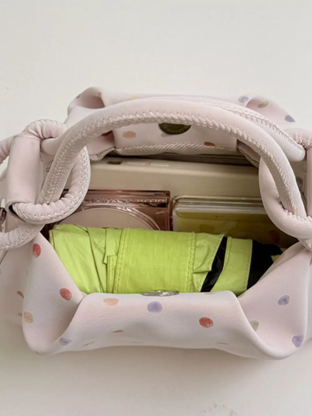 crossbody bag in light blue with bow charm and mini