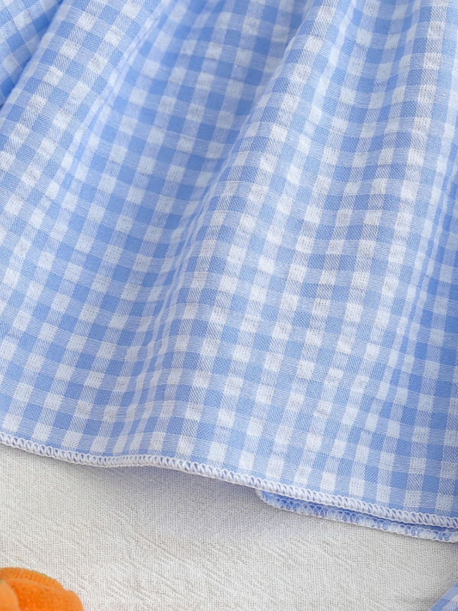 Baby set with blue and white gingham pattern and carrot embroidery detail.