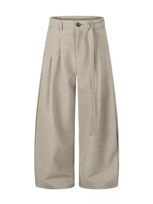 wide-leg pants in light beige featuring belted and wide-leg fit