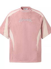 Pink athletic t-shirt for men with embroidered graphic and contrast panel details.