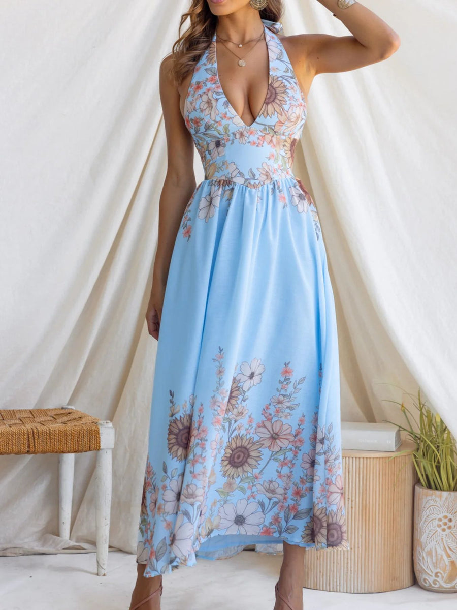 Blue floral halter neck maxi dress with a plunging neckline and empire waist.