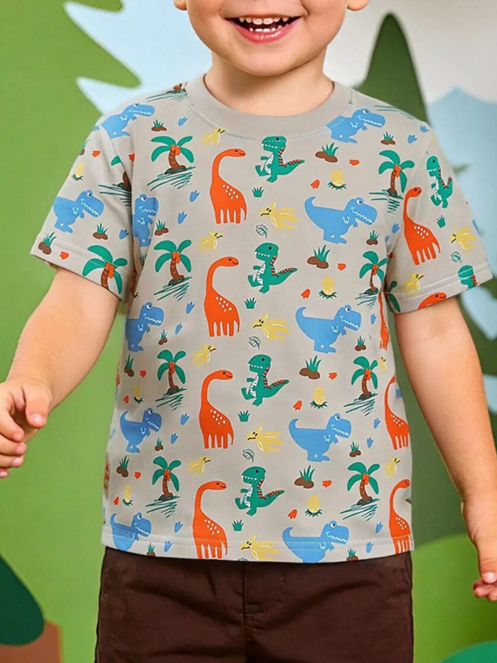 Toddler crew-neck t-shirt in grey with a colorful dinosaur and palm tree print.