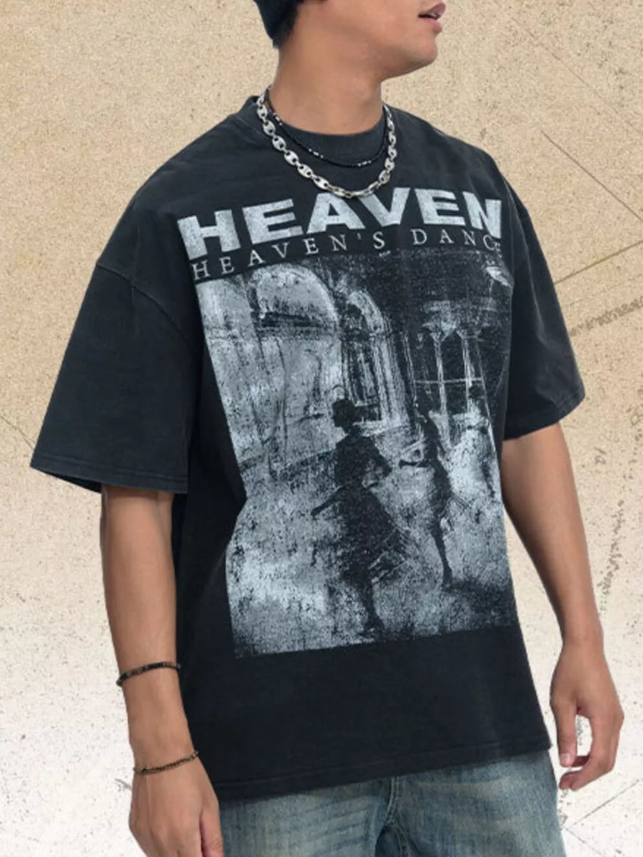 Black oversized graphic tee with crew neck and short sleeves, featuring a distressed "Heaven's Dance" print.
