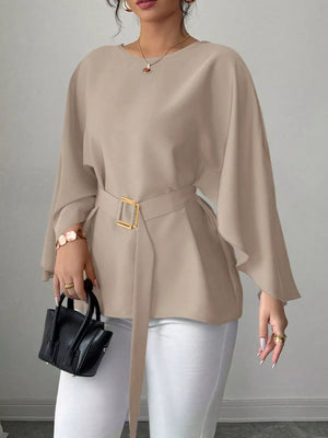 Khaki belted blouse with batwing sleeves and gold buckle detail.